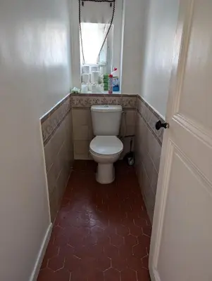 a bathroom with a toilet in a tiled floor at Heart of city 62m2 in Nice