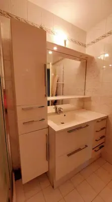 a bathroom with a sink and a mirror at Apartment with balcony 5 minutes walk from the sea in Cagnes-sur-Mer