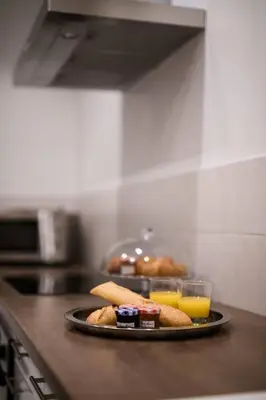 a plate of food on a counter in a kitchen at Le Trendy, plein centre avec climatisation in Nice