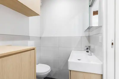 a bathroom with a white sink and a toilet at Charmant petit 2 pieces dans la vieille ville - B in Nice
