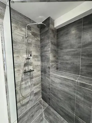 a bathroom with a shower with a glass door at Charmant 2pcs - 5min des plages in Cagnes-sur-Mer