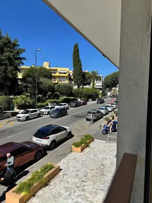 a view of a parking lot with cars parked at Charmant 2pcs - 5min des plages in Cagnes-sur-Mer
