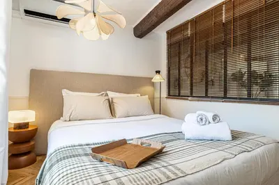 a bedroom with a bed with a tray on it at Two suites with AC in the heart of Old Nice, each with its own entrance in Nice
