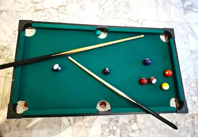 a green pool table with cue balls and chopsticks at T1 Bord De Mer Nice West in Nice
