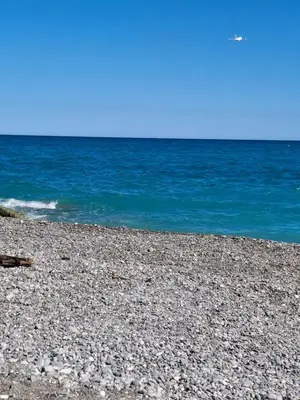 a rocky beach with the ocean in the background at T1 Bord De Mer Nice West in Nice