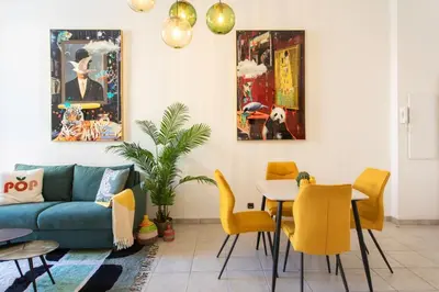 a living room with a couch and a table and chairs at #56 2P Massena Central close promenade,Old Town, AC in Nice