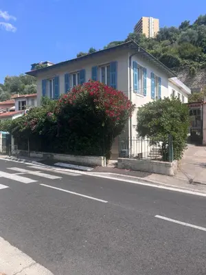 a house on the side of a street at Haut de maison niçoise - Calme, Charme et Vu Dégagée sur les Collines in Nice