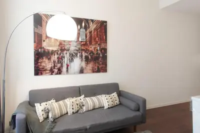 a living room with a couch with pillows on it at #60 Grimaldi 2BDR central near beach,promenade AC&WIFI in Nice