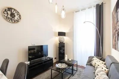 a living room with a couch and a tv at #60 Grimaldi 2BDR central near beach,promenade AC&WIFI in Nice