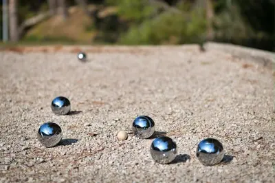 a group of balls sitting in the sand at Il Cielo in Nice