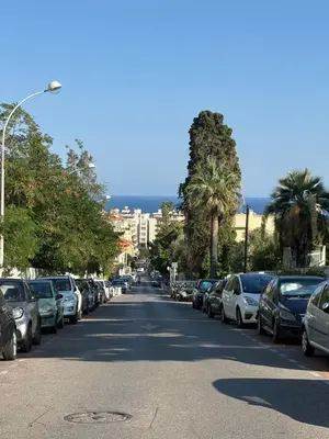 a street with cars parked on the sides of the road at Studio de Charme à Nice - Idéal télétravail - Balcon - Plage à 300m in Nice