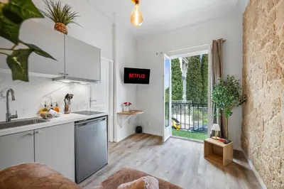 a kitchen with a sink and a counter top at Studio de Charme à Nice - Idéal télétravail - Balcon - Plage à 300m in Nice