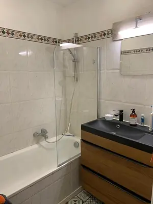 a bathroom with a shower and a tub and a sink at L'Échappée Belle in Nice