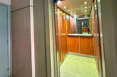 a bathroom with a shower and a door with a mirror at Magnifique Studio Le Renoir proche mer in Nice