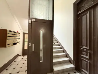 a hallway with a door and stairs in a house at Ze Perfect Place - Centre - Durandy - 2 Chb - AC in Nice