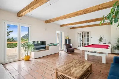 a living room with a pool table and a tv at La Quiétude - Spacious - Magnificent mountain view - AC - Jacuzzi in Aspremont