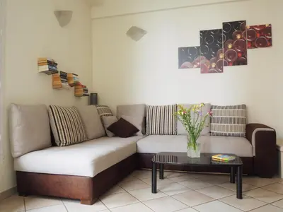 a living room with two couches and a table at Nice Centre - Apartment with balcony and stunning sea view! in Nice