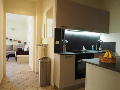 a kitchen with a sink and a refrigerator at Nice Centre - Apartment with balcony and stunning sea view! in Nice