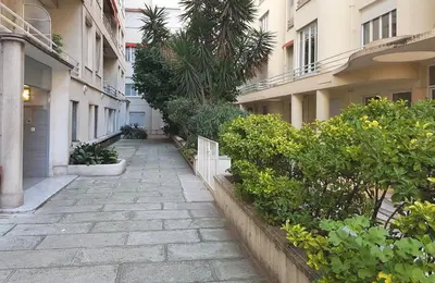 an alley way in a building with plants at Nice Centre - Apartment with balcony and stunning sea view! in Nice