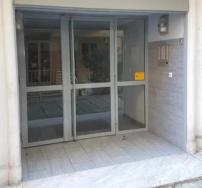 an entrance to a building with glass doors at Nice Centre - Apartment with balcony and stunning sea view! in Nice