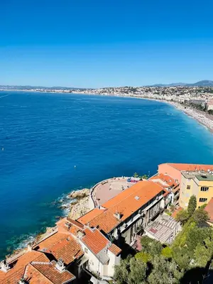 an aerial view of a beach and the ocean at L'Embarcadère - Port de Nice in Nice