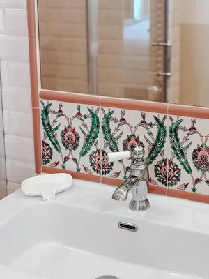 a bathroom sink with a mirror and a white sink at Azur Verdun in Nice