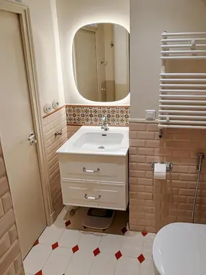 a bathroom with a sink and a mirror at Azur Verdun in Nice