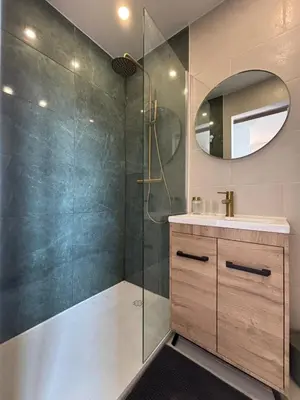 a bathroom with a shower and a sink and a mirror at Studio Nice proximité du port in Nice