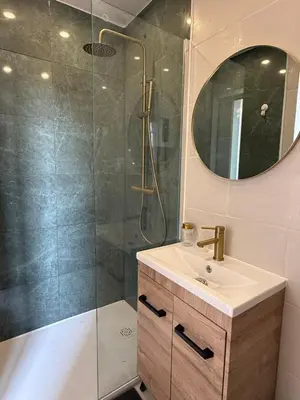 a bathroom with a shower and a sink and a mirror at Studio Nice proximité du port in Nice