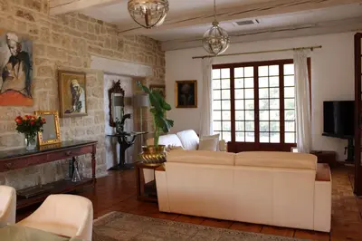 a living room with a couch and a fireplace at Magnifique Villa sur les collines de Nice, 6 Pièces, clim, barbecue, sauna et hammam in Nice