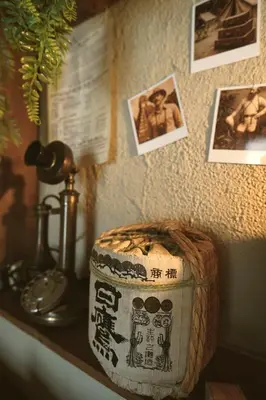 a basket sitting on a table with pictures on the wall at Suite des aventuriers - Expérience Unique & Atypique à Nice proche du centre in Nice