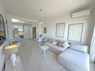 a living room with a couch and a table at Nice Seaview Loft Promenade in Nice
