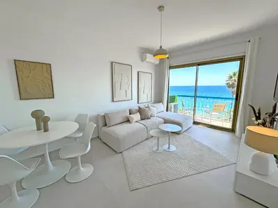 a living room with a couch and a table at Nice Seaview Loft Promenade in Nice