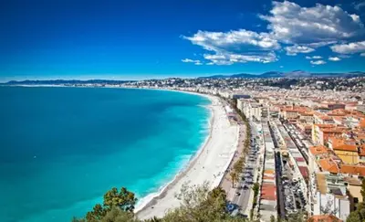 a view of a beach and the ocean at Jardin tropical, parking, climatisation in Nice