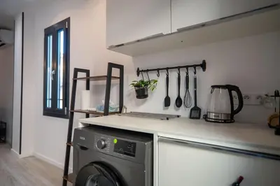 a kitchen with a washing machine in a room at Gambetta stay near attractions in Nice