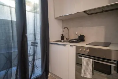 a kitchen with a sink and a stove top oven at Gambetta stay near attractions in Nice