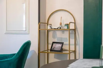 a room with a mirror and a table and chairs at Gambetta stay near attractions in Nice