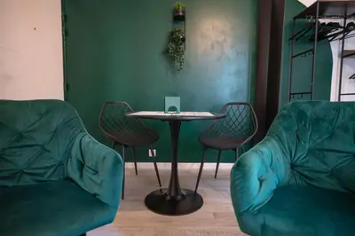 a room with two chairs and a table with a laptop at Gambetta stay near attractions in Nice