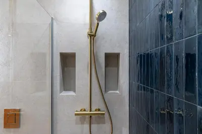 a shower with a shower head in a bathroom at NEW Appartement vieux Nice à côté de la plage AC in Nice