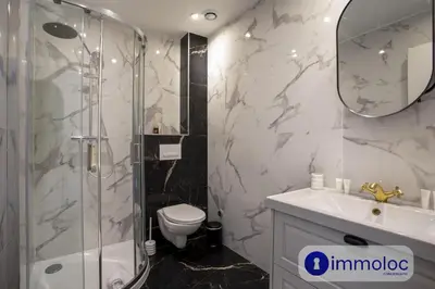 a bathroom with a shower and a toilet and a sink at Air-conditioned apartment in the Carras district close to the sea in Nice