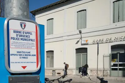 a sign in front of a white building at Nissa la bella in Nice