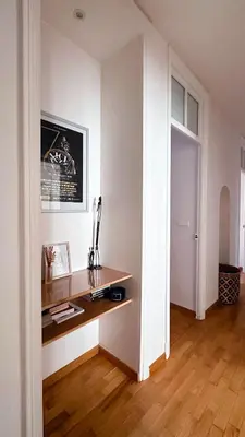 a room with a desk in the corner of a room at L'appart in Nice