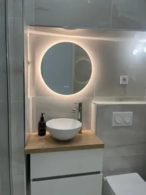 a bathroom with a bowl sink and a mirror at Havre de Paix à Nice in Nice