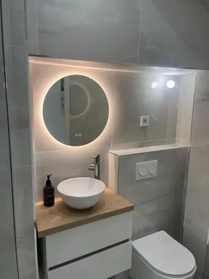a bathroom with a sink and a toilet and a mirror at Havre de Paix à Nice in Nice