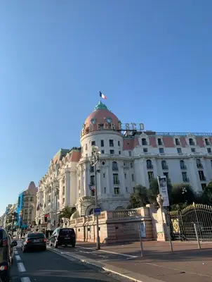 a large white building on the side of a street at Rossetti in Nice