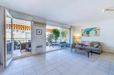 a living room with a couch and a table at FEEL HOME - CAIS De PIERLAS in Nice