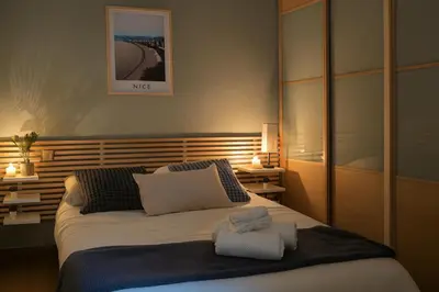 a bedroom with a bed with two towels on it at Vieux Nice Design & confort Mer à 2 min in Nice