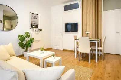 a living room with a couch and a table at Vieux Nice Design & confort Mer à 2 min in Nice