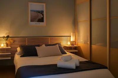 a bedroom with a bed with two towels on it at Vieux Nice Design & confort Mer à 2 min in Nice