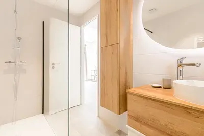 a bathroom with a sink and a glass shower at Sàvega - Climatisé et Proche Plage in Nice